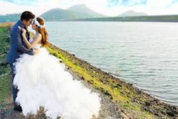 Couple on their wedding day beside the sea